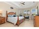 Serene main bedroom with tray ceilings, large windows, and ample natural light for relaxation at 14556 Gaspar Loop, Port Charlotte, FL 33981