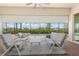 Inviting outdoor patio features comfortable seating overlooking a private pool and lush landscaping at 14556 Gaspar Loop, Port Charlotte, FL 33981