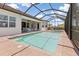 Inviting pool features brick pavers, with an attached spa tub and ample deck space at 14556 Gaspar Loop, Port Charlotte, FL 33981