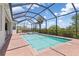 Gorgeous screened-in pool area with brick pavers, perfect for relaxing and entertaining outdoors at 14556 Gaspar Loop, Port Charlotte, FL 33981