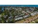 Scenic aerial view of a quiet residential neighborhood near the water, with mature trees and well-maintained properties at 148 Jose Gaspar Dr # 148, Englewood, FL 34223