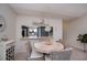 Cozy dining room with pendant lighting, seating for four and decor at 148 Jose Gaspar Dr # 148, Englewood, FL 34223