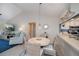 Dining room with pendant lighting, seating, and an open view to the living room at 148 Jose Gaspar Dr # 148, Englewood, FL 34223