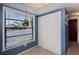 Bright entryway with large window, tiled floors, and closet for storage at 148 Jose Gaspar Dr # 148, Englewood, FL 34223
