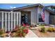 Inviting front entry with colorful flowers, painted entry door, and plenty of natural light at 148 Jose Gaspar Dr # 148, Englewood, FL 34223