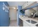 Kitchen featuring a stainless steel sink and modern cabinetry with a view to the living room at 148 Jose Gaspar Dr # 148, Englewood, FL 34223