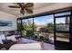 Relaxing screened patio with wicker furniture, plants, and view of well-maintained backyard at 148 Jose Gaspar Dr # 148, Englewood, FL 34223