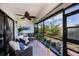 Relaxing screened patio with comfortable seating and access to the outdoors at 148 Jose Gaspar Dr # 148, Englewood, FL 34223