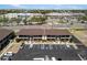 Aerial view of a multi-unit building with parking and nearby shopping centers at 1531 Placida Rd # 201, Englewood, FL 34223