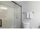 Bright bathroom featuring a glass shower door, modern fixtures, and neutral tones at 1531 Placida Rd # 201, Englewood, FL 34223