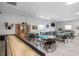 Light-filled community room with tables and chairs at Palm Manor at 1531 Placida Rd # 201, Englewood, FL 34223