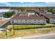 View of Palm Manor apartments complex showcasing landscaped grounds at 1531 Placida Rd # 201, Englewood, FL 34223