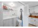A functional laundry room with washer, dryer, ample storage, and tiled flooring at 1531 Placida Rd # 201, Englewood, FL 34223