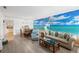 Open-concept living space with dining area, coastal decor, and plenty of natural light at 1531 Placida Rd # 201, Englewood, FL 34223
