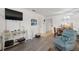 Inviting living room with modern flooring, decorative furnishings, and a ceiling fan at 1531 Placida Rd # 201, Englewood, FL 34223