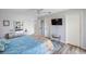 Bright bedroom features light-toned decor, calming decor, and a walk-out balcony at 1531 Placida Rd # 201, Englewood, FL 34223