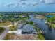 Waterfront property with a dock and room for an RV, boasting stunning views of the water and surrounding landscape at 15674 Applewhite Cir, Port Charlotte, FL 33981
