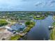 Waterfront property with a dock and room for an RV, boasting stunning views of the water and surrounding landscape at 15674 Applewhite Cir, Port Charlotte, FL 33981