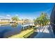 Backyard view of canal, dock, and waterfront at 15674 Applewhite Cir, Port Charlotte, FL 33981