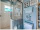 Charming bathroom with beaded shower curtain and nautical themed decor at 15674 Applewhite Cir, Port Charlotte, FL 33981