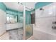 Well-lit bathroom featuring a tiled glass shower, a jetted soaking tub, and a white vanity with double sinks at 15674 Applewhite Cir, Port Charlotte, FL 33981