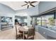Cozy dining area with natural light, tile floors, and views of the pool for a pleasant dining experience at 15674 Applewhite Cir, Port Charlotte, FL 33981