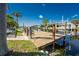 Waterfront property with a wood dock, deep water access, and boat lift; a boater's dream location at 15674 Applewhite Cir, Port Charlotte, FL 33981