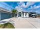 Beautiful home features a well-manicured lawn, a long driveway, and plenty of room to park your RV or boat at 15674 Applewhite Cir, Port Charlotte, FL 33981