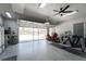 Bright and spacious garage includes workout area, epoxy floors, and extra-large vehicle door at 15674 Applewhite Cir, Port Charlotte, FL 33981