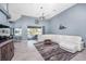 Large living room features contemporary furniture and provides access to the lanai and pool area at 15674 Applewhite Cir, Port Charlotte, FL 33981