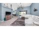 Spacious living room has modern furnishings, a ceiling fan, and a view of the pool at 15674 Applewhite Cir, Port Charlotte, FL 33981
