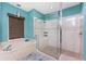 Bathroom showcasing a glass-enclosed shower with built-in seating and two showerheads, plus a jetted soaking tub at 15674 Applewhite Cir, Port Charlotte, FL 33981