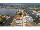 Aerial view of canal-front home featuring pool and waterfront access to the Gulf at 158 Morgan Se Ln, Port Charlotte, FL 33952