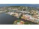 Waterfront home aerial view showcases a private pool and dock with easy access to the open water and scenic surroundings at 158 Morgan Se Ln, Port Charlotte, FL 33952