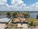 Waterfront home showcasing beautiful landscaping, and proximity to open water, ideal for boating and scenic views at 158 Morgan Se Ln, Port Charlotte, FL 33952