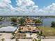 Waterfront home with solar panels, tiki hut, boat dock, and beautifully landscaped yard in desirable waterfront community at 158 Morgan Se Ln, Port Charlotte, FL 33952