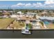 Waterfront home with boat dock, tiki hut, and pool in a quiet residential neighborhood at 158 Morgan Se Ln, Port Charlotte, FL 33952