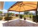 A covered patio with seating overlooks the landscaped lawn and waterfront at 158 Morgan Se Ln, Port Charlotte, FL 33952