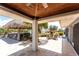 Covered patio with views of tiki bar, waterway, lush landscaping, and outdoor seating at 158 Morgan Se Ln, Port Charlotte, FL 33952