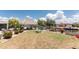 Spacious backyard featuring a tiki hut and waterfront views, perfect for outdoor entertaining and relaxation at 158 Morgan Se Ln, Port Charlotte, FL 33952