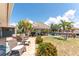 A covered patio with seating and a tiki bar on a landscaped waterfront lot at 158 Morgan Se Ln, Port Charlotte, FL 33952
