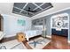 Nautical-themed main bedroom featuring a decorative ceiling, hardwood floors, and an en-suite bathroom at 158 Morgan Se Ln, Port Charlotte, FL 33952
