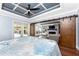Spacious bedroom featuring a decorative ceiling, hardwood floors, sliding doors, and ample natural light at 158 Morgan Se Ln, Port Charlotte, FL 33952