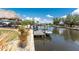 Waterfront home featuring a private dock with a boat lift and tiki hut; relax with scenic water views at 158 Morgan Se Ln, Port Charlotte, FL 33952