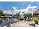 Waterfront property featuring a private boat dock, lift, and easy access to the water at 158 Morgan Se Ln, Port Charlotte, FL 33952