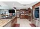 Beautiful kitchen featuring a gas stove, granite counters, stainless steel appliances, and custom cabinets at 158 Morgan Se Ln, Port Charlotte, FL 33952