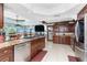 Stylish kitchen with granite countertops, stainless steel appliances, and a functional layout at 158 Morgan Se Ln, Port Charlotte, FL 33952