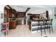 Spacious open kitchen with dark wood cabinetry, granite countertops, and stainless steel appliances at 158 Morgan Se Ln, Port Charlotte, FL 33952