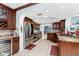 Modern kitchen features stainless steel appliances, cherry cabinets, and custom lighting at 158 Morgan Se Ln, Port Charlotte, FL 33952