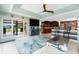 Living room featuring a waterfront view, blue accent furniture, and access to the kitchen at 158 Morgan Se Ln, Port Charlotte, FL 33952